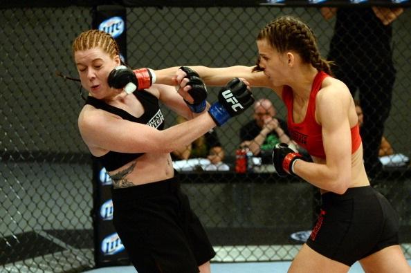 LAS VEGAS, NV - MAY 29:  Jessamyn Duke (R) punches Laura Howarth in their elimination fight during filming of season eighteen of The Ultimate Fighter on May 29, 2013 in Las Vegas, Nevada. (Photo by Al Powers/Zuffa LLC/Zuffa LLC via Getty Images) 