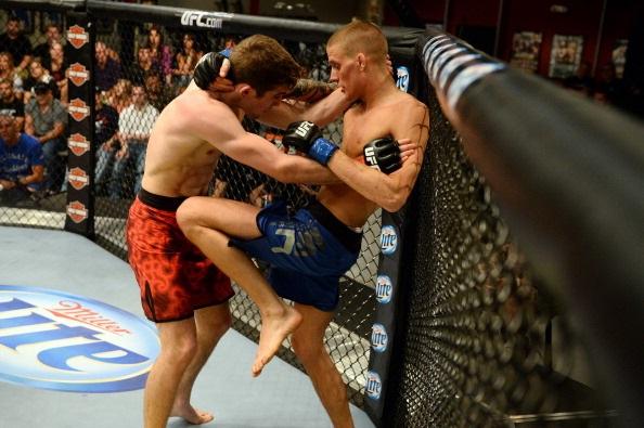 LAS VEGAS, NV - MAY 29:  Emil Hartsner (R) knees Michael Wootten in their elimination fight during filming of season eighteen of The Ultimate Fighter on May 29, 2013 in Las Vegas, Nevada. (Photo by Al Powers/Zuffa LLC/Zuffa LLC via Getty Images) 