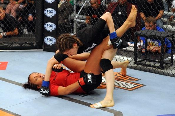 LAS VEGAS, NV - MAY 29:  Roxanne Modafferi (R) punches Valeri Letourneau in their elimination fight during filming of season eighteen of The Ultimate Fighter on May 29, 2013 in Las Vegas, Nevada. (Photo by Al Powers/Zuffa LLC/Zuffa LLC via Getty Images) 