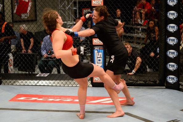 LAS VEGAS, NV - MAY 29:  Tara Larosa (R) punches Sarah Moras in their elimination fight during filming of season eighteen of The Ultimate Fighter on May 29, 2013 in Las Vegas, Nevada. (Photo by Al Powers/Zuffa LLC/Zuffa LLC via Getty Images) 