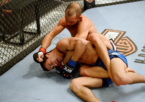 LAS VEGAS, NV - MAY 29: Matt Munsey (R) punches Anthony Gutierrez in their elimination fight during filming of season eighteen of The Ultimate Fighter on May 29, 2013 in Las Vegas, Nevada. (Photo by Al Powers/Zuffa LLC/Zuffa LLC via Getty Images)