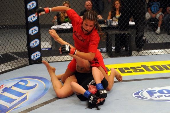 LAS VEGAS, NV - MAY 29: Julianna Pena (top) punches Gina Mazany in their elimination fight during filming of season eighteen of The Ultimate Fighter on May 29, 2013 in Las Vegas, Nevada. (Photo by Al Powers/Zuffa LLC/Zuffa LLC via Getty Images)
