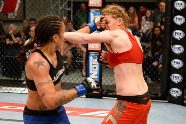 LAS VEGAS, NV - MAY 29:  Raquel Pennington (L)  punches Tonya Evinger in their elimination fight during filming of season eighteen of The Ultimate Fighter on May 29, 2013 in Las Vegas, Nevada. (Photo by Al Powers/Zuffa LLC/Zuffa LLC via Getty Images) 