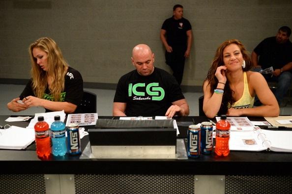 LAS VEGAS, NV - MAY 29:  (L-R) Coach Ronda Rousey, UFC President Dana White and coach Miesha Tate analyze fighters during filming of season eighteen of The Ultimate Fighter on May 29, 2013 in Las Vegas, Nevada. (Photo by Al Powers/Zuffa LLC/Zuffa LLC via 