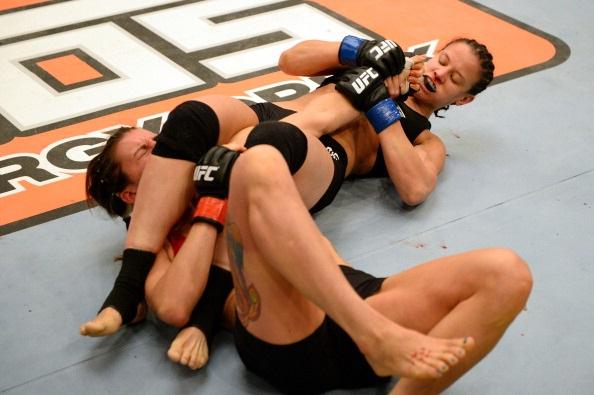 LAS VEGAS, NV - MAY 29:  Shayna Baszler (R) puts Colleen Schneider in an armbar in their elimination fight during filming of season eighteen of The Ultimate Fighter on May 29, 2013 in Las Vegas, Nevada. (Photo by Al Powers/Zuffa LLC/Zuffa LLC via Getty Im