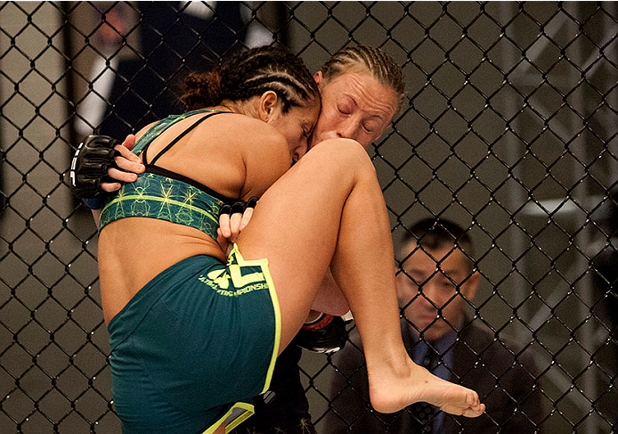 LAS VEGAS, NV - JULY 15:  (L-R) Team Pettis fighter Jessica Penne knees team Melendez fighter Lisa Ellis during filming of season twenty of The Ultimate Fighter on July 15, 2014 in Las Vegas, Nevada. (Photo by Brandon Magnus/Zuffa LLC/Zuffa LLC via Getty 