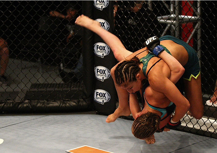 LAS VEGAS, NV - JULY 15: Team Pettis fighter Jessica Penne takes down team Melendez fighter Lisa Ellis during filming of season twenty of The Ultimate Fighter on July 15, 2014 in Las Vegas, Nevada. (Photo by Brandon Magnus/Zuffa LLC/Zuffa LLC via Getty I