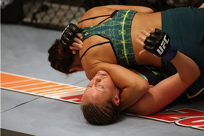 LAS VEGAS, NV - JULY 15:  (Top) Team Pettis fighter Jessica Penne controls the body of team Melendez fighter Lisa Ellis during filming of season twenty of The Ultimate Fighter on July 15, 2014 in Las Vegas, Nevada. (Photo by Brandon Magnus/Zuffa LLC/Zuffa