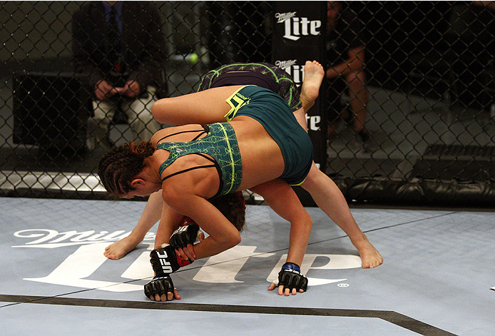 LAS VEGAS, NV - JULY 15: (Top) Team Pettis fighter Jessica Penne controls the body of team Melendez fighter Lisa Ellis during filming of season twenty of The Ultimate Fighter on July 15, 2014 in Las Vegas, Nevada. (Photo by Brandon Magnus/Zuffa LLC/Zuffa
