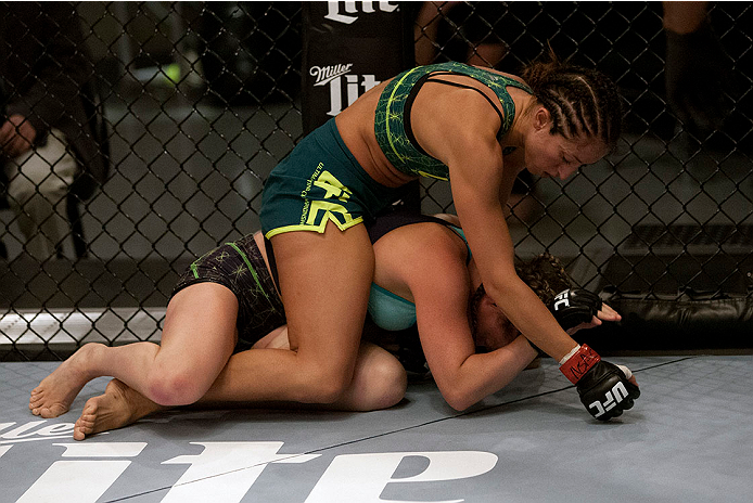 LAS VEGAS, NV - JULY 15:  (Top) Team Pettis fighter Jessica Penne controls the body of team Melendez fighter Lisa Ellis during filming of season twenty of The Ultimate Fighter on July 15, 2014 in Las Vegas, Nevada. (Photo by Brandon Magnus/Zuffa LLC/Zuffa