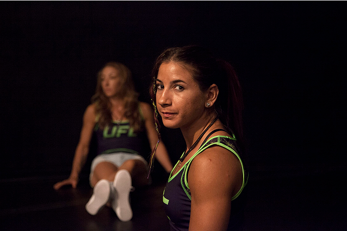 LAS VEGAS, NV - JULY 10:  Team Melendez fighters Tecia Torres and Heather Jo Clark wait to watch teammate Lisa Ellis fight team Pettis fighter Jessica Penne during filming of season twenty of The Ultimate Fighter on July 10, 2014 in Las Vegas, Nevada. (Ph