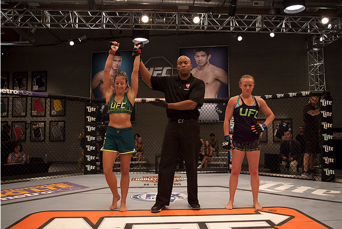 LAS VEGAS, NV - JULY 15:  Team Pettis fighter Jessica Penne celebrates her victory over team Melendez fighter Lisa Ellis during filming of season twenty of The Ultimate Fighter on July 15, 2014 in Las Vegas, Nevada. (Photo by Brandon Magnus/Zuffa LLC/Zuff