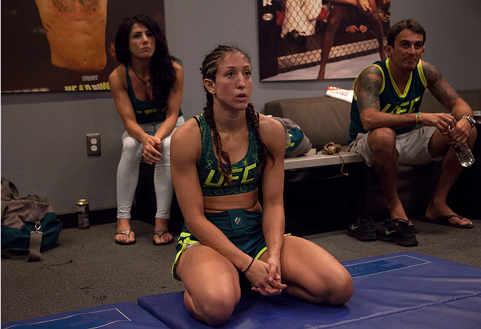 LAS VEGAS, NV - JULY 15: Team Pettis fighter Jessica Penne talks with her teammates after her victory over team Melendez fighter Lisa Ellis during filming of season twenty of The Ultimate Fighter on July 15, 2014 in Las Vegas, Nevada. (Photo by Brandon M