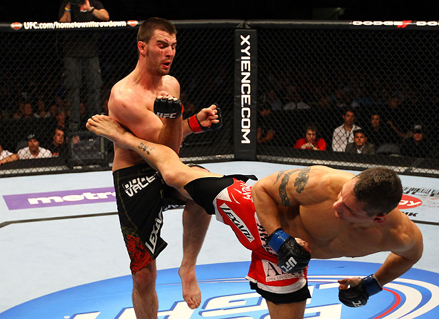 ATLANTA, GA - APRIL 21: Chris Clements kicks Keith Wisniewski (L) during their welterweight bout for UFC 145 at Philips Arena on April 21, 2012 in Atlanta, Georgia. (Photo by Al Bello/Zuffa LLC/Zuffa LLC via Getty Images)