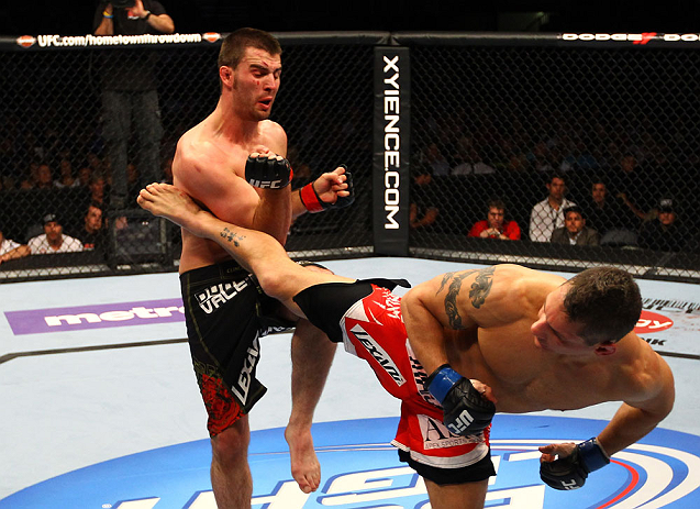 ATLANTA, GA - APRIL 21:  Chris Clements kicks Keith Wisniewski (L) during their welterweight bout for UFC 145 at Philips Arena on April 21, 2012 in Atlanta, Georgia.  (Photo by Al Bello/Zuffa LLC/Zuffa LLC via Getty Images)