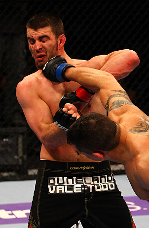 ATLANTA, GA - APRIL 21:  Chris Clements (R) punches Keith Wisniewski during their welterweight bout for UFC 145 at Philips Arena on April 21, 2012 in Atlanta, Georgia.  (Photo by Al Bello/Zuffa LLC/Zuffa LLC via Getty Images)