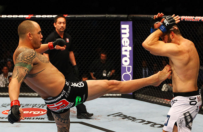 ATLANTA, GA - APRIL 21: Travis Browne (L) kicks Chad Griggs during their heavyweight bout for UFC 145 at Philips Arena on April 21, 2012 in Atlanta, Georgia. (Photo by Al Bello/Zuffa LLC/Zuffa LLC via Getty Images)