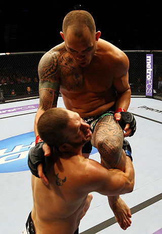 ATLANTA, GA - APRIL 21: Travis Browne (back) lands a knee on Chad Griggs during their heavyweight bout for UFC 145 at Philips Arena on April 21, 2012 in Atlanta, Georgia. (Photo by Al Bello/Zuffa LLC/Zuffa LLC via Getty Images)