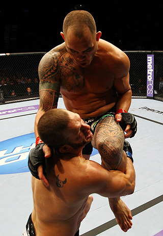 ATLANTA, GA - APRIL 21:  Travis Browne (back) lands a knee on Chad Griggs during their heavyweight bout for UFC 145 at Philips Arena on April 21, 2012 in Atlanta, Georgia.  (Photo by Al Bello/Zuffa LLC/Zuffa LLC via Getty Images)