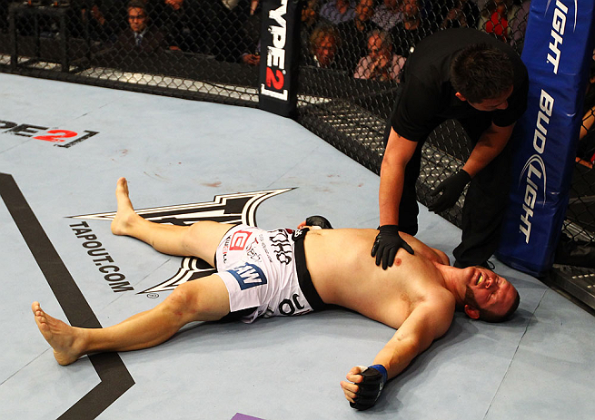 ATLANTA, GA - APRIL 21:  Chad Griggs lays on the mat after tapping out during his heavyweight bout against Travis Browne for UFC 145 at Philips Arena on April 21, 2012 in Atlanta, Georgia.  (Photo by Al Bello/Zuffa LLC/Zuffa LLC via Getty Images)