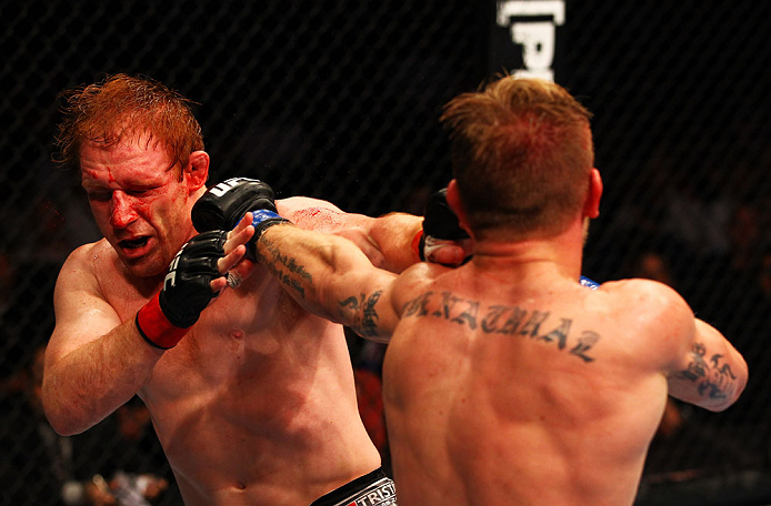ATLANTA, GA - APRIL 21: John Alessio (R) hits Mark Bocek during their lightweight bout for UFC 145 at Philips Arena on April 21, 2012 in Atlanta, Georgia. (Photo by Al Bello/Zuffa LLC/Zuffa LLC via Getty Images)