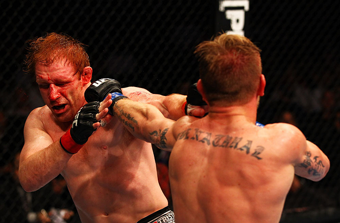 ATLANTA, GA - APRIL 21:  John Alessio (R) hits Mark Bocek during their lightweight bout for UFC 145 at Philips Arena on April 21, 2012 in Atlanta, Georgia.  (Photo by Al Bello/Zuffa LLC/Zuffa LLC via Getty Images)