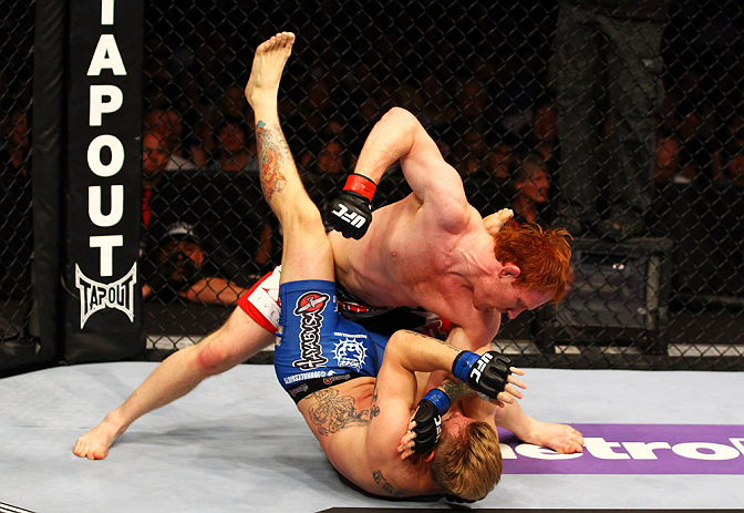 ATLANTA, GA - APRIL 21: Mark Bocek (top) punches John Alessio during their lightweight bout for UFC 145 at Philips Arena on April 21, 2012 in Atlanta, Georgia. (Photo by Al Bello/Zuffa LLC/Zuffa LLC via Getty Images)