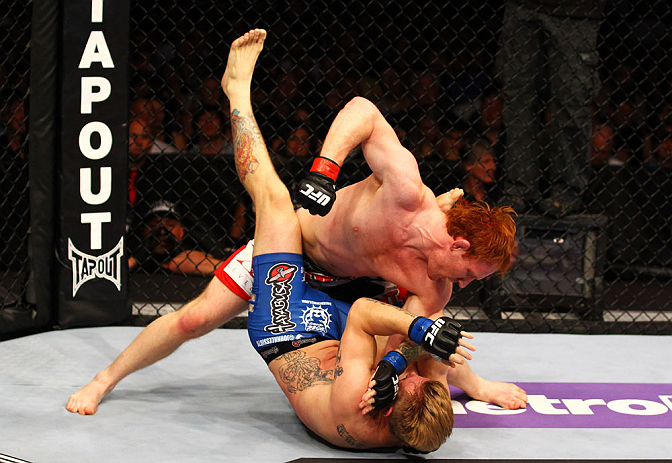 ATLANTA, GA - APRIL 21:  Mark Bocek (top) punches John Alessio during their lightweight bout for UFC 145 at Philips Arena on April 21, 2012 in Atlanta, Georgia.  (Photo by Al Bello/Zuffa LLC/Zuffa LLC via Getty Images)