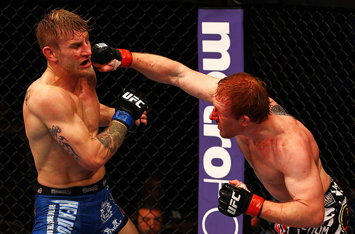 ATLANTA, GA - APRIL 21: Mark Bocek (R) punches John Alessio during their lightweight bout for UFC 145 at Philips Arena on April 21, 2012 in Atlanta, Georgia. (Photo by Al Bello/Zuffa LLC/Zuffa LLC via Getty Images)