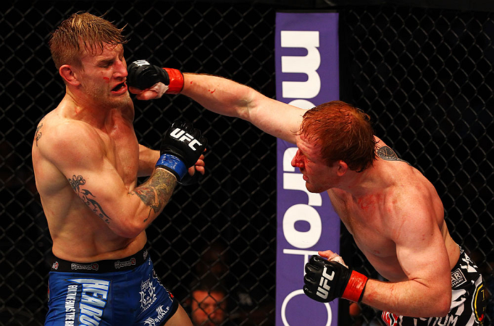 ATLANTA, GA - APRIL 21:  Mark Bocek (R) punches John Alessio during their lightweight bout for UFC 145 at Philips Arena on April 21, 2012 in Atlanta, Georgia.  (Photo by Al Bello/Zuffa LLC/Zuffa LLC via Getty Images)