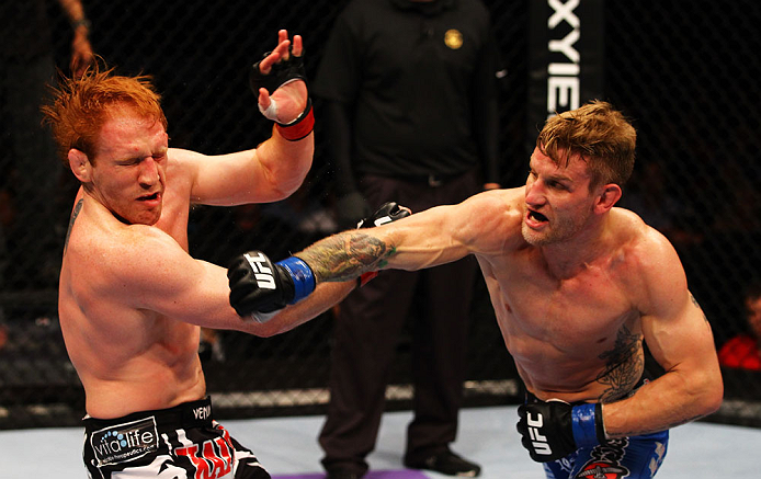 ATLANTA, GA - APRIL 21: John Alessio (R) punches Mark Bocek during their lightweight bout for UFC 145 at Philips Arena on April 21, 2012 in Atlanta, Georgia. (Photo by Al Bello/Zuffa LLC/Zuffa LLC via Getty Images)