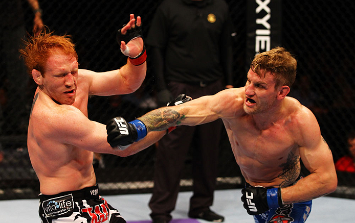 ATLANTA, GA - APRIL 21:  John Alessio (R) punches Mark Bocek during their lightweight bout for UFC 145 at Philips Arena on April 21, 2012 in Atlanta, Georgia.  (Photo by Al Bello/Zuffa LLC/Zuffa LLC via Getty Images)