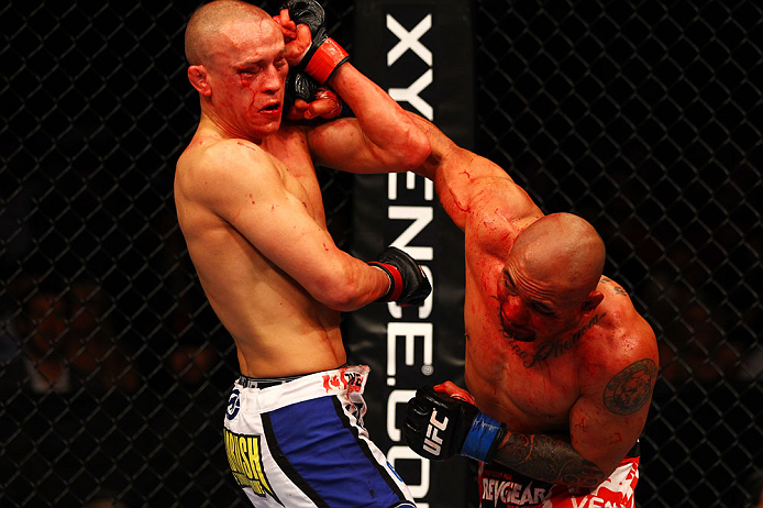ATLANTA, GA - APRIL 21: Eddie Yagin (R) punches Mark Hominick during their featherweight bout for UFC 145 at Philips Arena on April 21, 2012 in Atlanta, Georgia. (Photo by Al Bello/Zuffa LLC/Zuffa LLC via Getty Images)