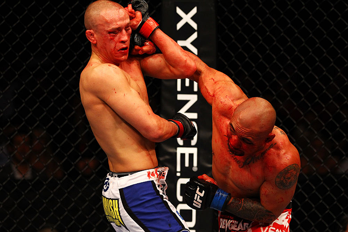 ATLANTA, GA - APRIL 21:  Eddie Yagin (R) punches Mark Hominick during their featherweight bout for UFC 145 at Philips Arena on April 21, 2012 in Atlanta, Georgia.  (Photo by Al Bello/Zuffa LLC/Zuffa LLC via Getty Images)