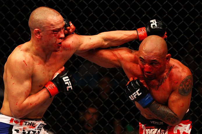 ATLANTA, GA - APRIL 21: Eddie Yagin (R) punches Mark Hominick during their featherweight bout for UFC 145 at Philips Arena on April 21, 2012 in Atlanta, Georgia. (Photo by Al Bello/Zuffa LLC/Zuffa LLC via Getty Images)