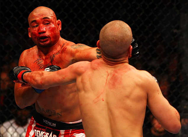 ATLANTA, GA - APRIL 21: Eddie Yagin (L) punches Mark Hominick during their featherweight bout for UFC 145 at Philips Arena on April 21, 2012 in Atlanta, Georgia. (Photo by Al Bello/Zuffa LLC/Zuffa LLC via Getty Images)