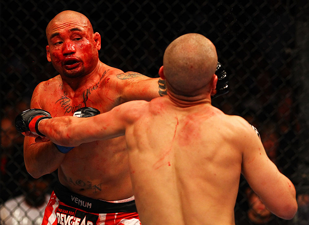 ATLANTA, GA - APRIL 21:  Eddie Yagin (L) punches Mark Hominick during their featherweight bout for UFC 145 at Philips Arena on April 21, 2012 in Atlanta, Georgia.  (Photo by Al Bello/Zuffa LLC/Zuffa LLC via Getty Images)