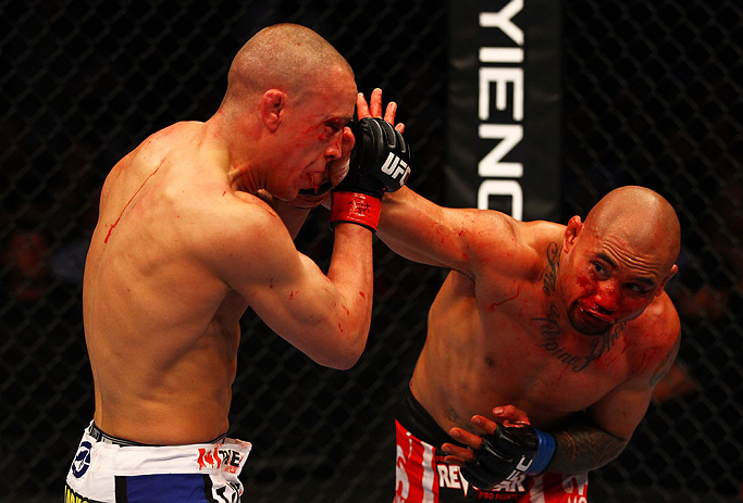 ATLANTA, GA - APRIL 21: Eddie Yagin (R) punches Mark Hominick during their featherweight bout for UFC 145 at Philips Arena on April 21, 2012 in Atlanta, Georgia. (Photo by Al Bello/Zuffa LLC/Zuffa LLC via Getty Images)