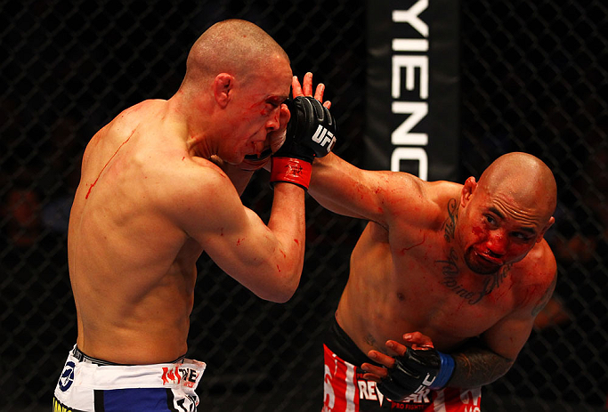 ATLANTA, GA - APRIL 21:  Eddie Yagin (R) punches Mark Hominick during their featherweight bout for UFC 145 at Philips Arena on April 21, 2012 in Atlanta, Georgia.  (Photo by Al Bello/Zuffa LLC/Zuffa LLC via Getty Images)