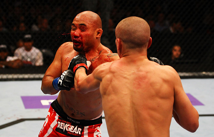 ATLANTA, GA - APRIL 21:  Mark Hominick (R) punches Eddie Yagin during their featherweight bout for UFC 145 at Philips Arena on April 21, 2012 in Atlanta, Georgia.  (Photo by Al Bello/Zuffa LLC/Zuffa LLC via Getty Images)