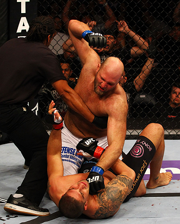 ATLANTA, GA - APRIL 21: The official stops the fight as Ben Rothwell (top) punches Brendan Schaub during their heavyweight bout for UFC 145 at Philips Arena on April 21, 2012 in Atlanta, Georgia. (Photo by Al Bello/Zuffa LLC/Zuffa LLC via Getty Images)