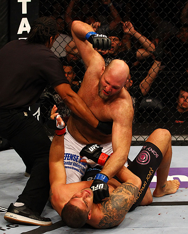 ATLANTA, GA - APRIL 21:  The official stops the fight as Ben Rothwell (top) punches Brendan Schaub during their heavyweight bout for UFC 145 at Philips Arena on April 21, 2012 in Atlanta, Georgia.  (Photo by Al Bello/Zuffa LLC/Zuffa LLC via Getty Images)