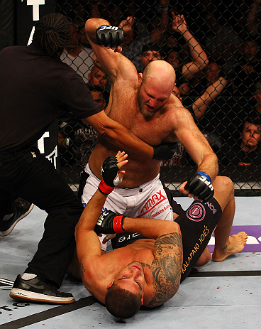 ATLANTA, GA - APRIL 21: The official stops the fight as Ben Rothwell (top) punches Brendan Schaub during their heavyweight bout for UFC 145 at Philips Arena on April 21, 2012 in Atlanta, Georgia. (Photo by Al Bello/Zuffa LLC/Zuffa LLC via Getty Images)