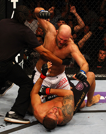 ATLANTA, GA - APRIL 21:  The official stops the fight as Ben Rothwell (top) punches Brendan Schaub during their heavyweight bout for UFC 145 at Philips Arena on April 21, 2012 in Atlanta, Georgia.  (Photo by Al Bello/Zuffa LLC/Zuffa LLC via Getty Images)