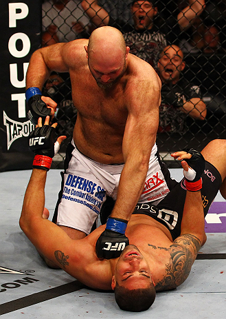 ATLANTA, GA - APRIL 21:  Ben Rothwell (top) punches Brendan Schaub during their heavyweight bout for UFC 145 at Philips Arena on April 21, 2012 in Atlanta, Georgia.  (Photo by Al Bello/Zuffa LLC/Zuffa LLC via Getty Images)