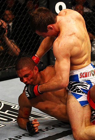 ATLANTA, GA - APRIL 21: Rory MacDonald 9top) punches Che Mills during their welterweight bout for UFC 145 at Philips Arena on April 21, 2012 in Atlanta, Georgia. (Photo by Al Bello/Zuffa LLC/Zuffa LLC via Getty Images)