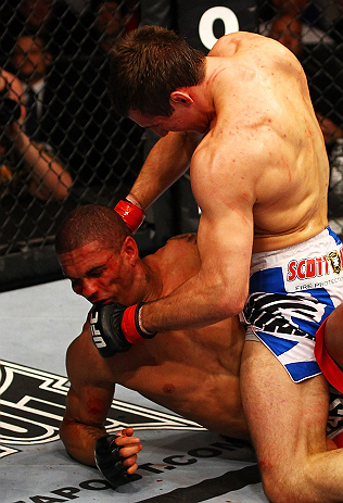 ATLANTA, GA - APRIL 21:  Rory MacDonald 9top) punches Che Mills during their welterweight bout for UFC 145 at Philips Arena on April 21, 2012 in Atlanta, Georgia.  (Photo by Al Bello/Zuffa LLC/Zuffa LLC via Getty Images)