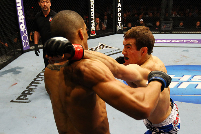 ATLANTA, GA - APRIL 21:  Rory MacDonald (R) punches Che Mills during their welterweight bout for UFC 145 at Philips Arena on April 21, 2012 in Atlanta, Georgia.  (Photo by Al Bello/Zuffa LLC/Zuffa LLC via Getty Images)