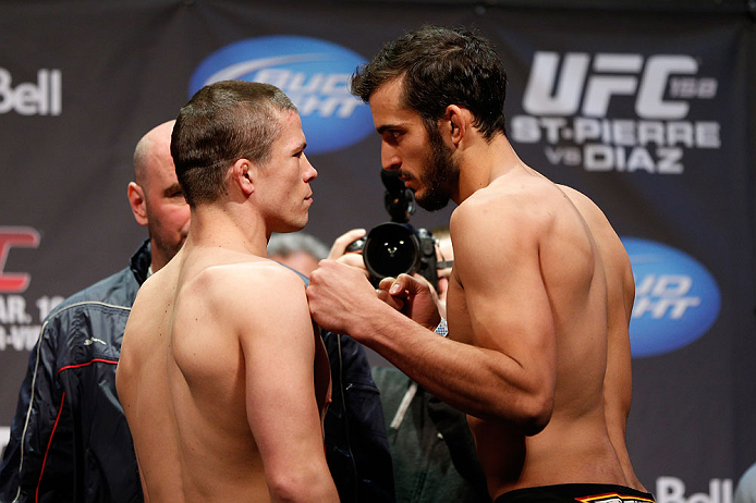 MONTREAL, QC - MARCH 15: (L-R) Rick Story and Quinn Mulhern face off during the UFC 158 weigh-in at Bell Centre on March 15, 2013 in Montreal, Quebec, Canada. (Photo by Josh Hedges/Zuffa LLC/Zuffa LLC via Getty Images)
