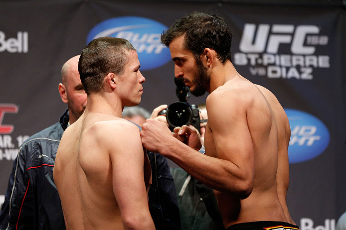 MONTREAL, QC - MARCH 15:  (L-R) Rick Story and Quinn Mulhern face off during the UFC 158 weigh-in at Bell Centre on March 15, 2013 in Montreal, Quebec, Canada.  (Photo by Josh Hedges/Zuffa LLC/Zuffa LLC via Getty Images)